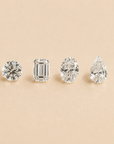 Four diamonds of different shapes on a beige background